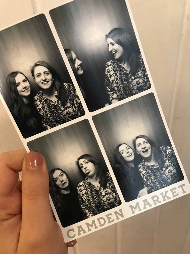 A polaroid picture of friends from a photo booth