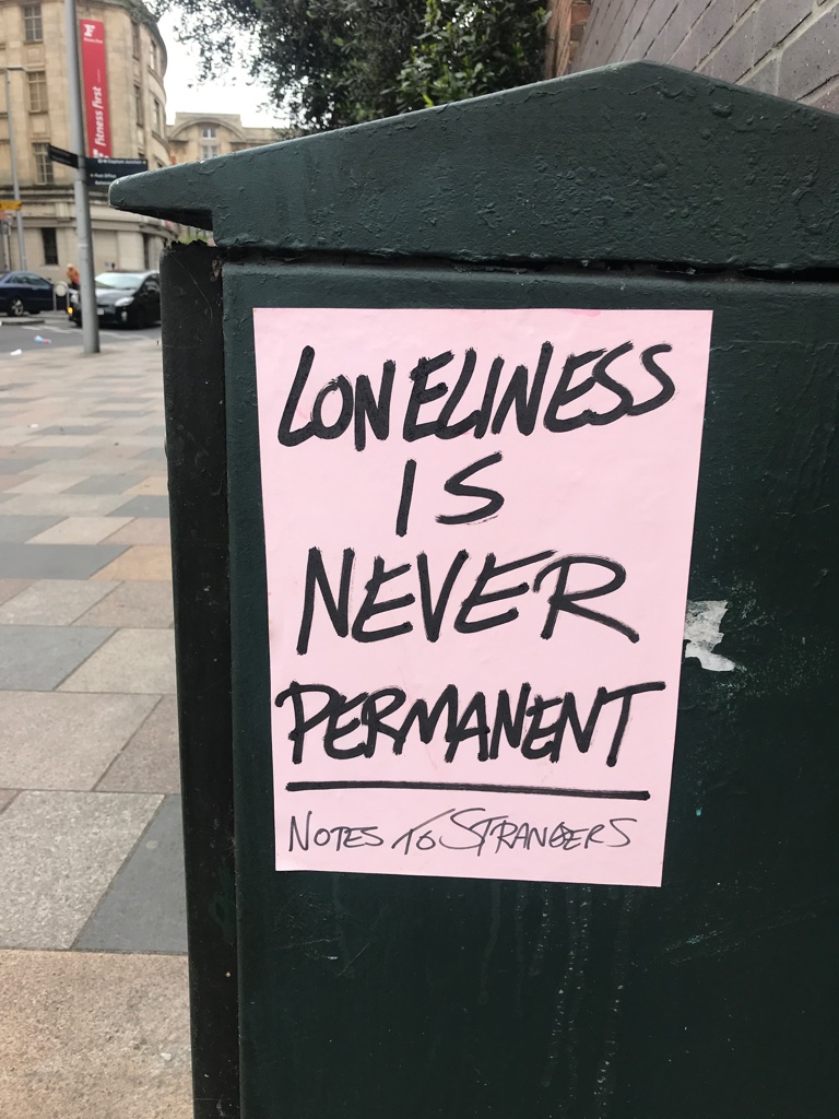 A poster saying 'loneliness is never permanent'